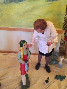 Bavarian Inn matriarch Dorothy Zehnder and her great-grandchildren Luke and Sofia Grossi worked together on the Glockenspiel restoration by freshening up paint on the figurines.
